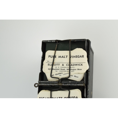 254 - 'The Alchemist Label Rack' with 6 sections for holding paper bottle labels, 43.5cm long, with some o... 