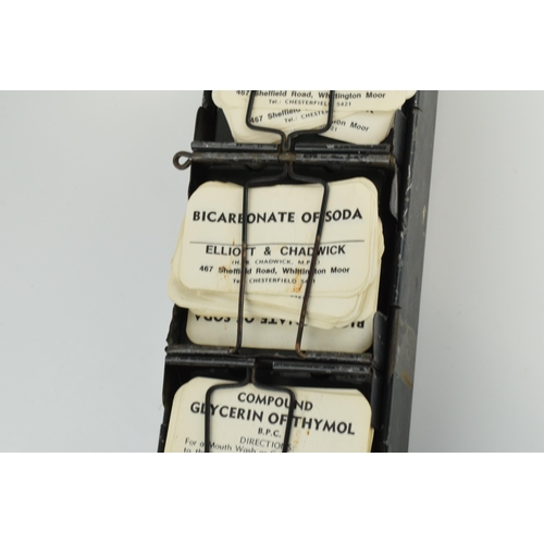 254 - 'The Alchemist Label Rack' with 6 sections for holding paper bottle labels, 43.5cm long, with some o... 