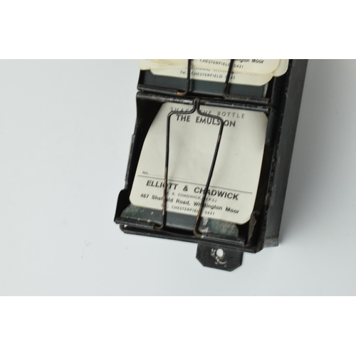 254 - 'The Alchemist Label Rack' with 6 sections for holding paper bottle labels, 43.5cm long, with some o... 