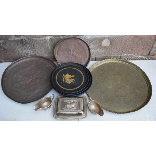 256 - A collection of Eastern copper and brass trays, largest 63cm diameter, some with incised decoration,... 