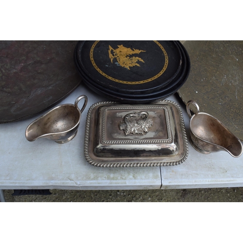 256 - A collection of Eastern copper and brass trays, largest 63cm diameter, some with incised decoration,... 