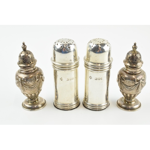 302 - Two pairs of silver cruet sets, one set with ornate decoration, the others of plainer form, 95.6 gra... 