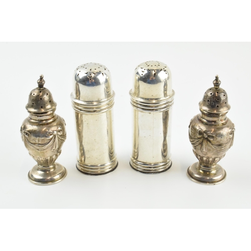 302 - Two pairs of silver cruet sets, one set with ornate decoration, the others of plainer form, 95.6 gra... 