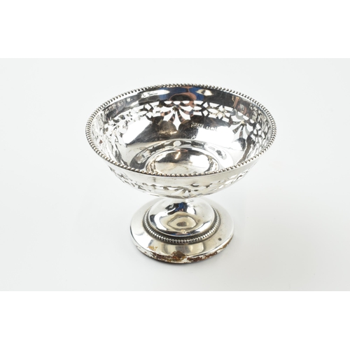 304 - A pair of silver items to include an ornate pedestal sweet dish, Birmingham 1922, loaded base, and a... 