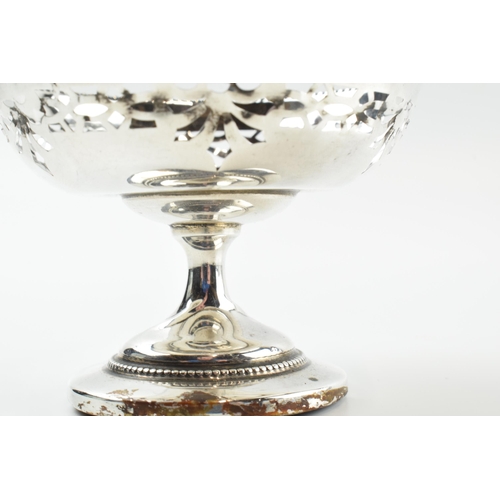 304 - A pair of silver items to include an ornate pedestal sweet dish, Birmingham 1922, loaded base, and a... 