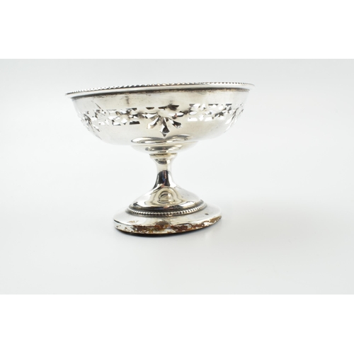 304 - A pair of silver items to include an ornate pedestal sweet dish, Birmingham 1922, loaded base, and a... 