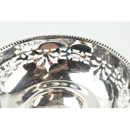 304 - A pair of silver items to include an ornate pedestal sweet dish, Birmingham 1922, loaded base, and a... 