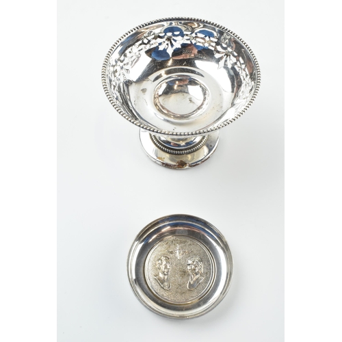 304 - A pair of silver items to include an ornate pedestal sweet dish, Birmingham 1922, loaded base, and a... 