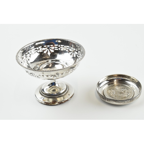 304 - A pair of silver items to include an ornate pedestal sweet dish, Birmingham 1922, loaded base, and a... 