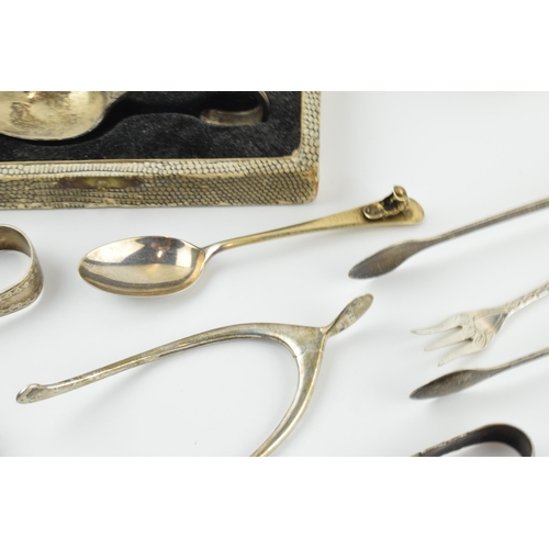 307 - An interesting collection of silver items to include Georgian, Victorian and later silver items to i... 