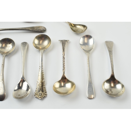 310 - A good collection of silver condiment spoons of varying forms, sizes and ages, 58.4 grams (12).