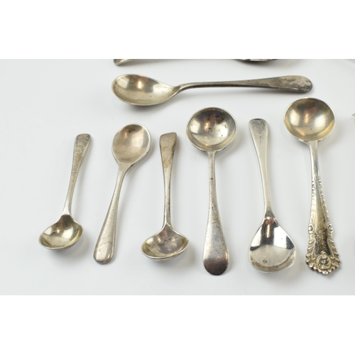 310 - A good collection of silver condiment spoons of varying forms, sizes and ages, 58.4 grams (12).