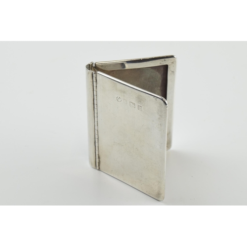 311 - Hallmarked silver novelty photo frame in the form of a book, 63 grams, Birmingham 1902, 6cm tall.