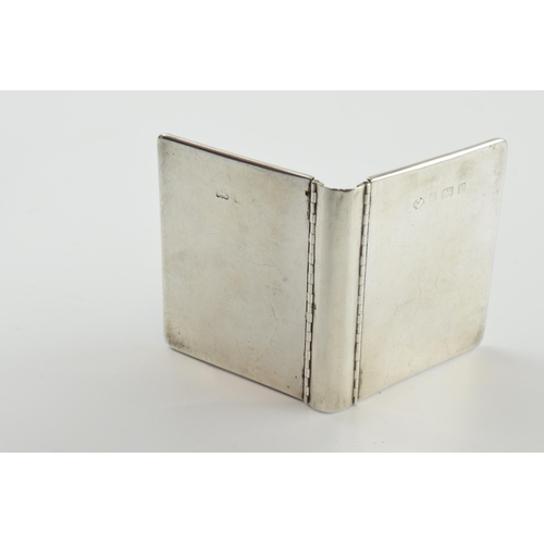 311 - Hallmarked silver novelty photo frame in the form of a book, 63 grams, Birmingham 1902, 6cm tall.