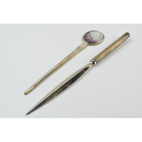 314 - Sterling silver letter opener with carved abalone inset together with a similar silver handled item ... 