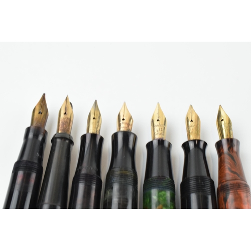 386 - A collection of fountain pens with 14ct gold nibs to include makes such as Burnham, Swan, Jackdaw an... 