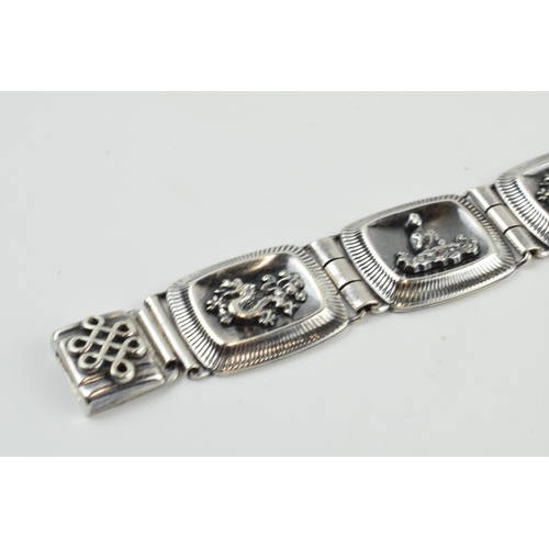 390 - 935 silver Chinese export silver panel link bracelet with dragon motifs, 33.7 grams, 20.5cm long.