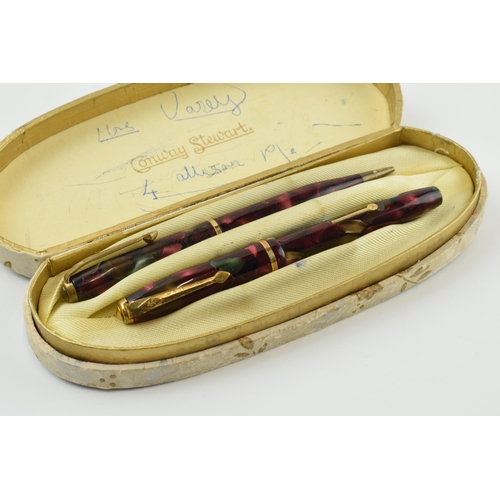 391 - Cased Conway Stewart fountain pen with 14ct gold nib and propelling pencil.