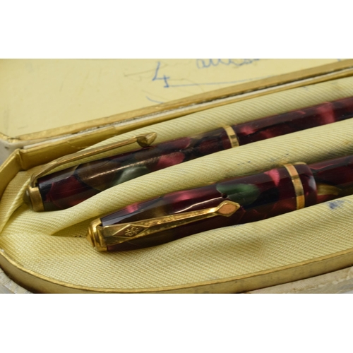 391 - Cased Conway Stewart fountain pen with 14ct gold nib and propelling pencil.