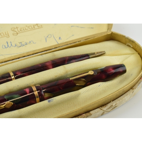 391 - Cased Conway Stewart fountain pen with 14ct gold nib and propelling pencil.