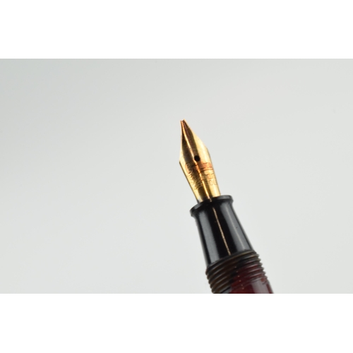 391 - Cased Conway Stewart fountain pen with 14ct gold nib and propelling pencil.