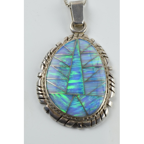 392 - Sterling silver necklace with opal set pendant 'DT @' and 'Sterling' to rear, chain 56cm long, penda... 