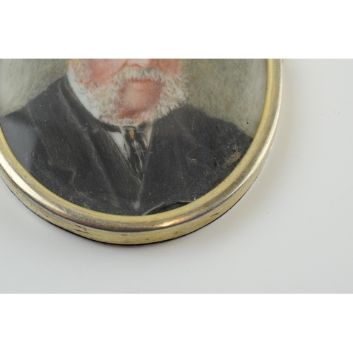 393 - Late Victorian miniature portrait of a bearded wise gentleman set in silver gilt frame, 7.5cm tall.