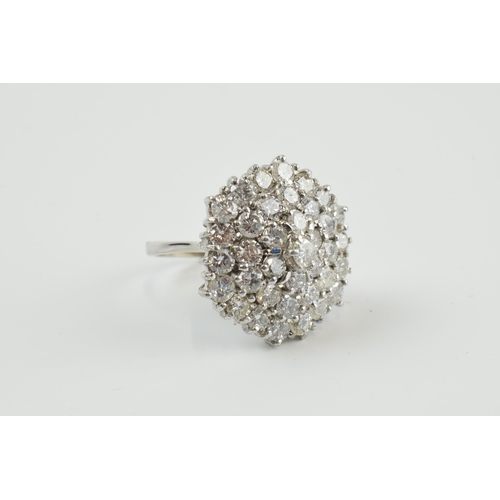 411 - 18ct white gold diamond cluster ring, set with circa 3.7ct of diamond stones, 37 diamonds, 9.37 gram... 