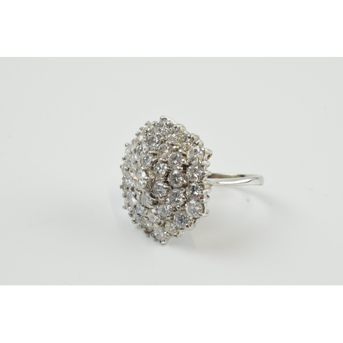 411 - 18ct white gold diamond cluster ring, set with circa 3.7ct of diamond stones, 37 diamonds, 9.37 gram... 