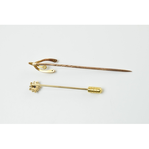 413 - A pair of 9ct gold stick pins, one with a diamond, the other a sapphire, metal pins, gross weight 1.... 