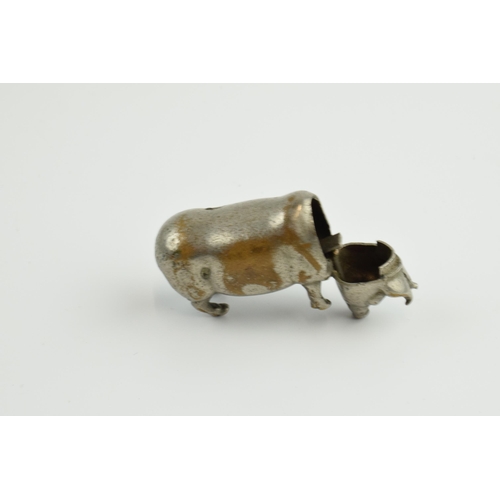 414 - Interesting items to include a novelty plated vesta case in the form of a pig, a pair of white metal... 