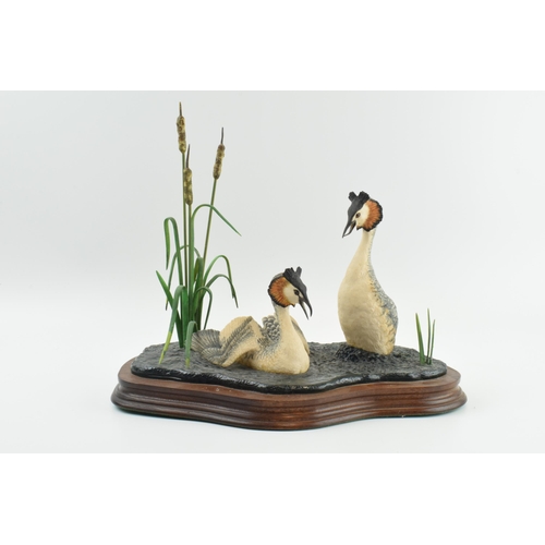 94 - Border Fine Arts 'Courting Grebes' WW3 by Ray Ayres, 29cm long.