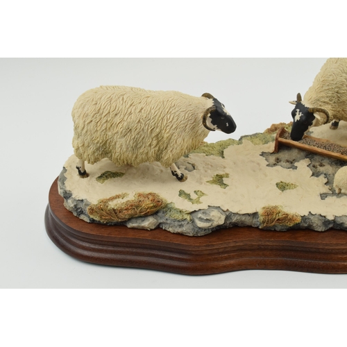 96 - Border Fine Arts figure group 'Early Lambs Late Snow' by Ray Ayres, 35cm long, wooden base.