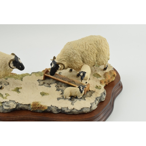 96 - Border Fine Arts figure group 'Early Lambs Late Snow' by Ray Ayres, 35cm long, wooden base.