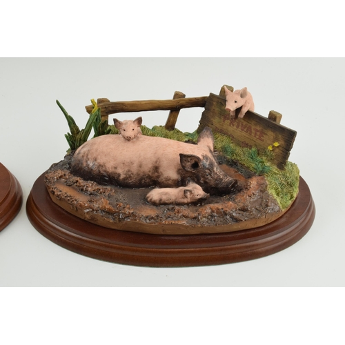 99 - Border Fine Arts figure group 'The Great Escape' and 'Mud Spa', both with pigs, wooden bases (2).