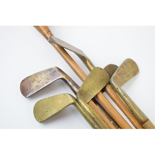 196 - Vintage child's golf clubs to include a vintage canvas bag complete with 6 brass headed irons / putt... 