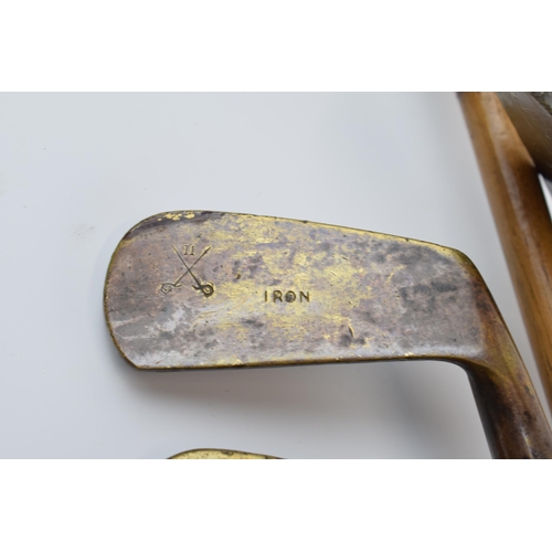 196 - Vintage child's golf clubs to include a vintage canvas bag complete with 6 brass headed irons / putt... 