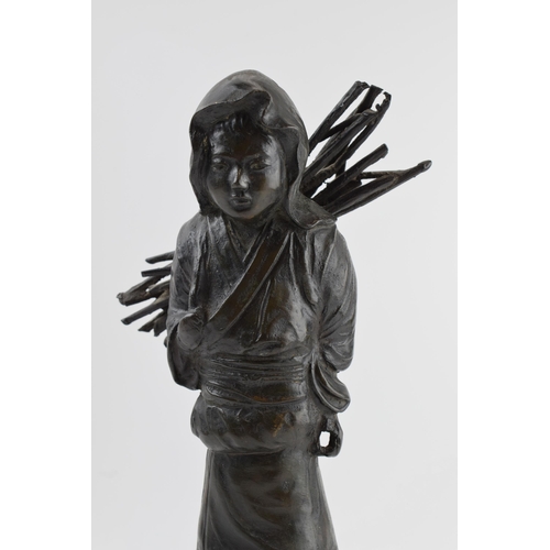 200 - Japanese influenced bronzed sculpture of a girl carrying sticks, 33cm tall.