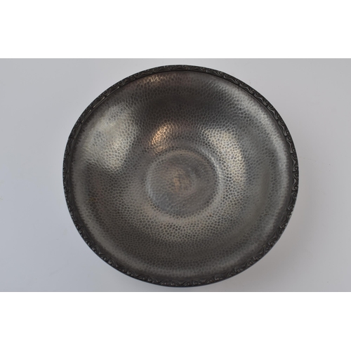 257 - Liberty Tudric pewter bowl with hammered decoration, '01354' to underside along with stamps, 25cm di... 