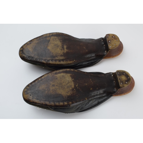 267 - A pair of Russian hand embroidered shoes with overlaid decoration, 25cm long.