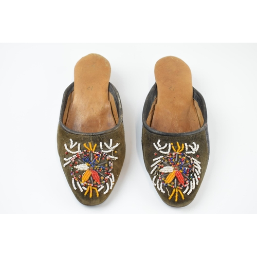 267 - A pair of Russian hand embroidered shoes with overlaid decoration, 25cm long.