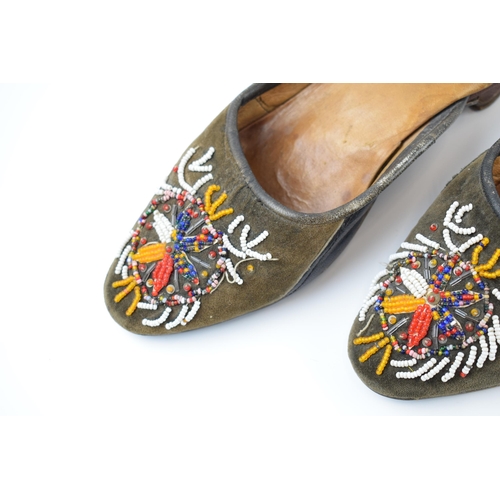 267 - A pair of Russian hand embroidered shoes with overlaid decoration, 25cm long.