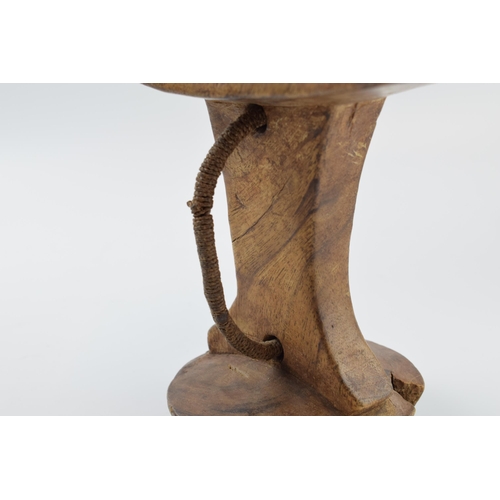 269 - African tribal head rest with rope / string handle, 21cm wide, 18cm tall.