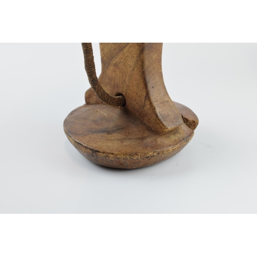 269 - African tribal head rest with rope / string handle, 21cm wide, 18cm tall.