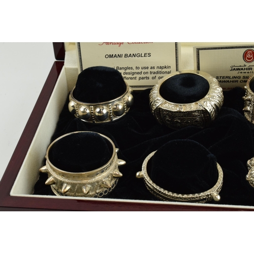 Jawahir Oman a set of 6 sterling silver napkin rings in the form of