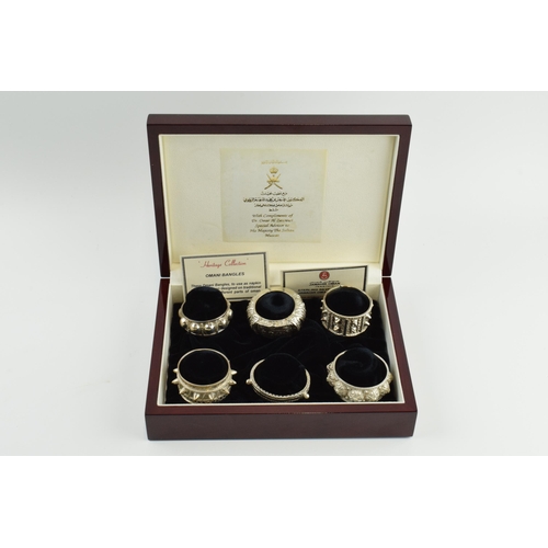 Jawahir Oman a set of 6 sterling silver napkin rings in the form of