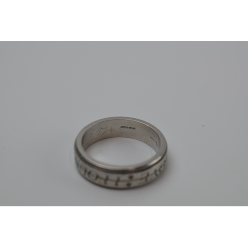 419 - Platinum 950 Brown and Newitt puzzle ring set with diamonds 'I Found Love', 8.2 grams, size M/N.