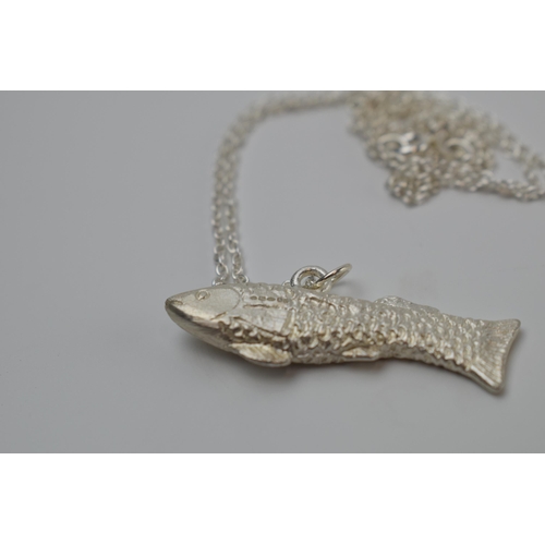 421 - Mappin and Webb silver fish pendant on silver chain, chain 45cm long.