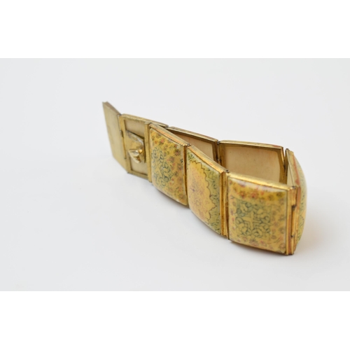 427 - Yellow metal and oriental panel bracelet, 19.5cm long.