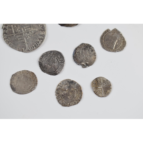 280A - An interesting collection of hammered silver coins of varying sizes and denominations to include Eli... 